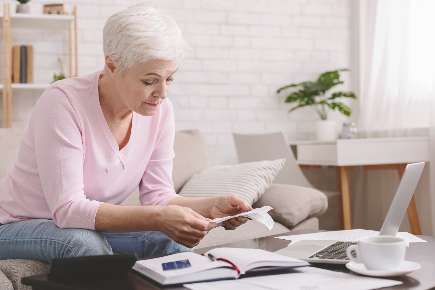 White woman doing financial planning at computer – Birchwood FP